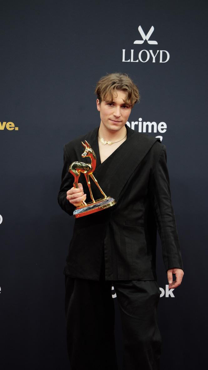 Fionn holding an award
